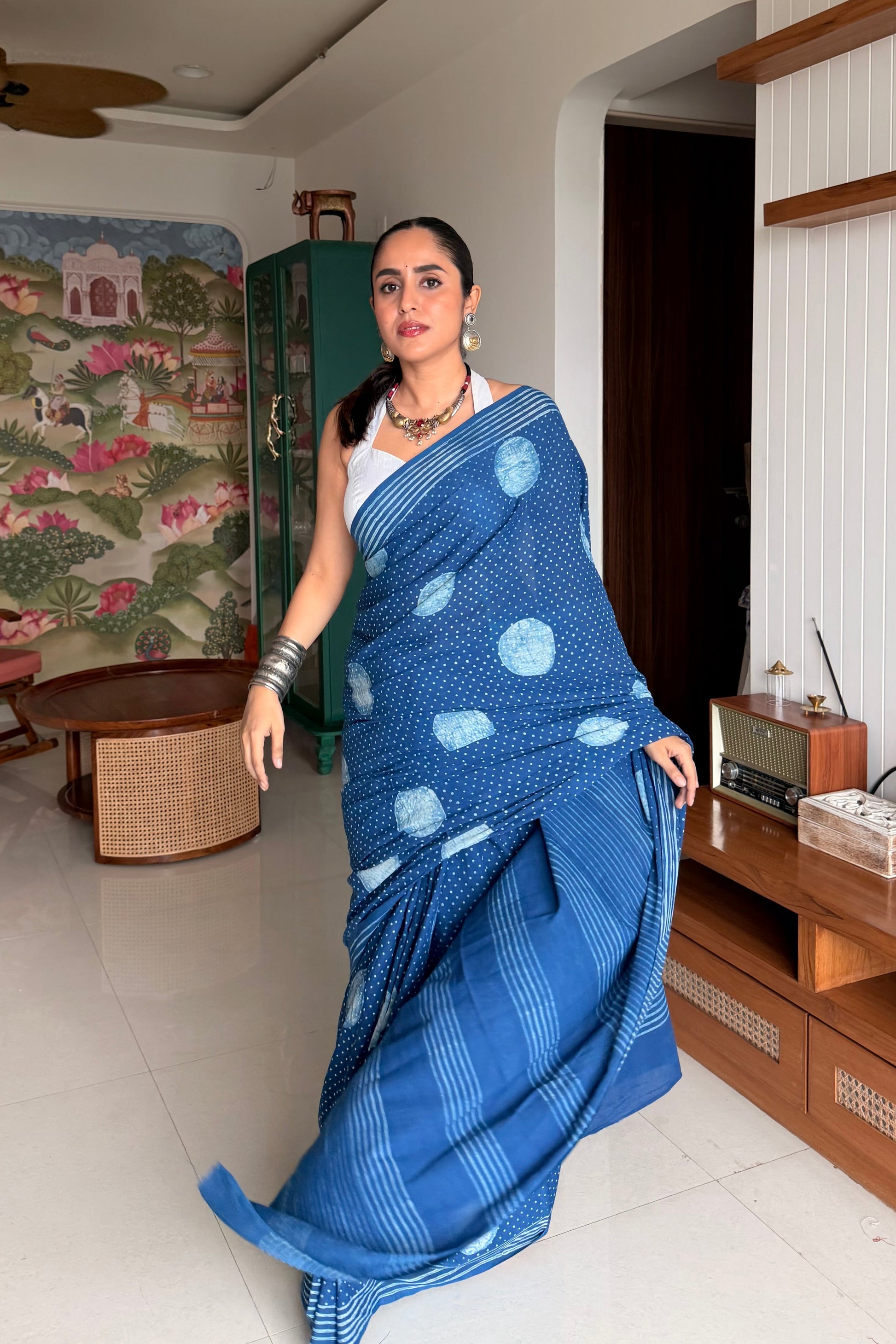 Traditional indigo blue cotton saree featuring geometric designs.