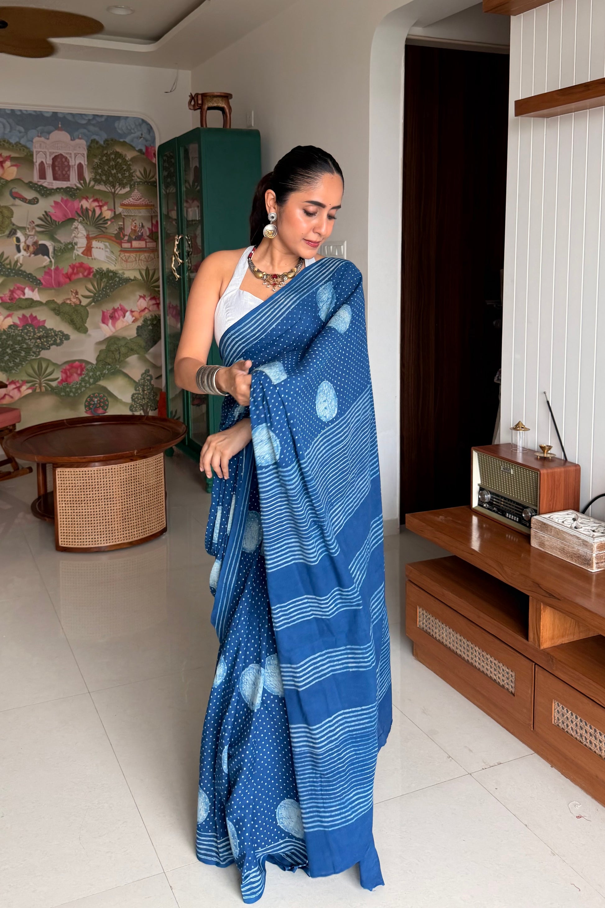Soft indigo blue mulmul cotton saree for comfortable daily wear.