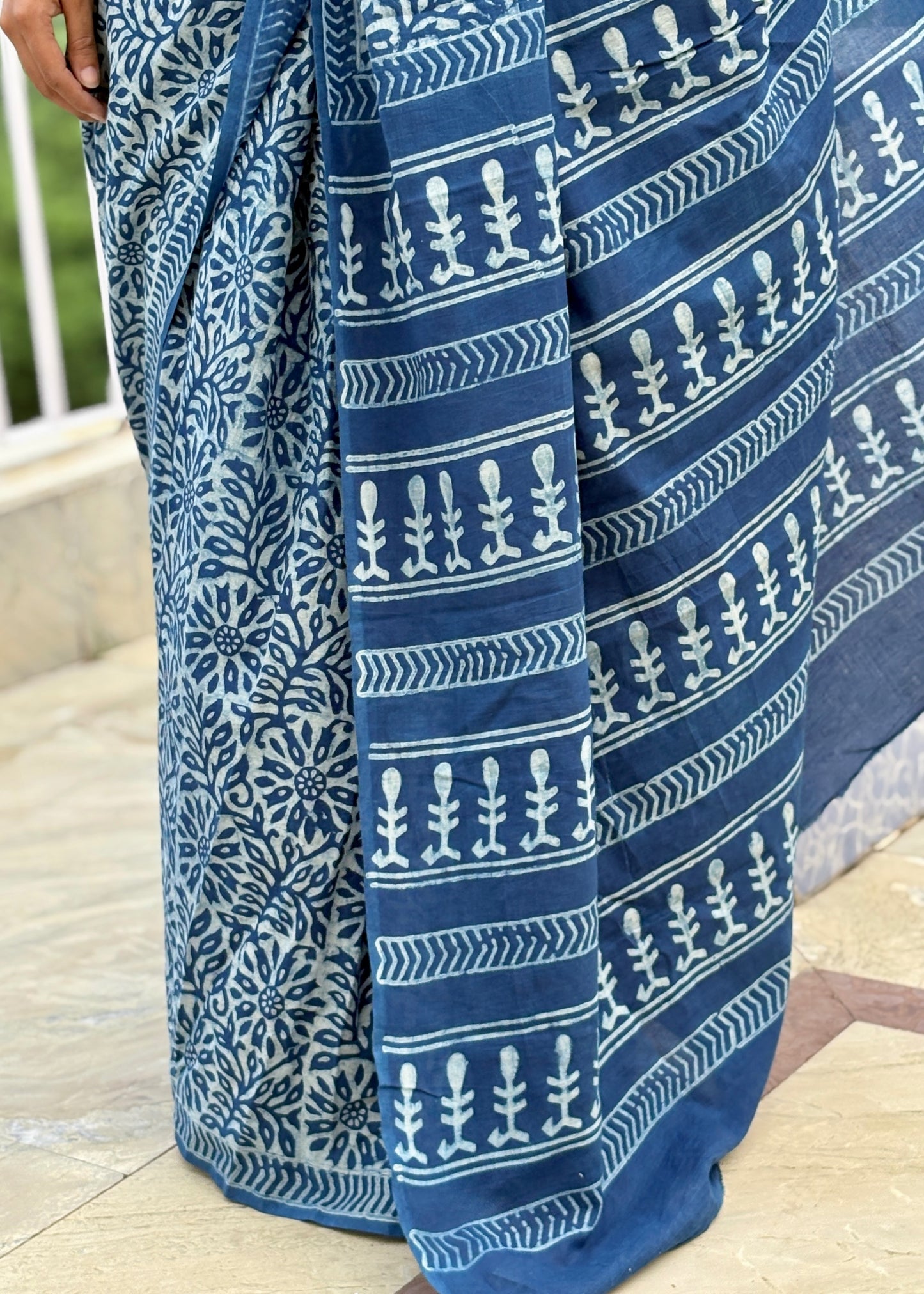 Blue and white patterned fabric draped over a surface