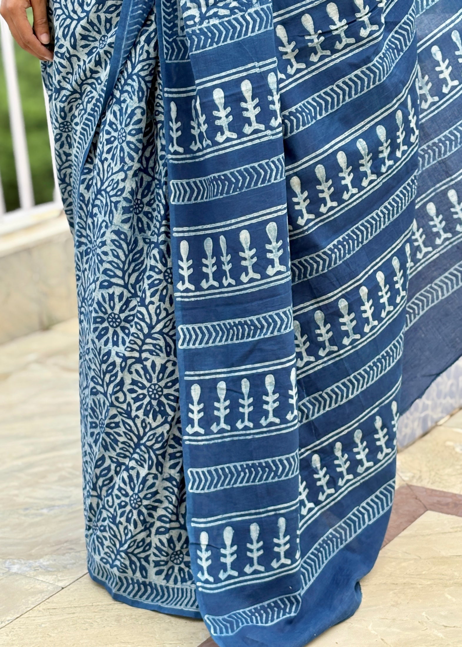 Blue and white patterned fabric draped over a surface